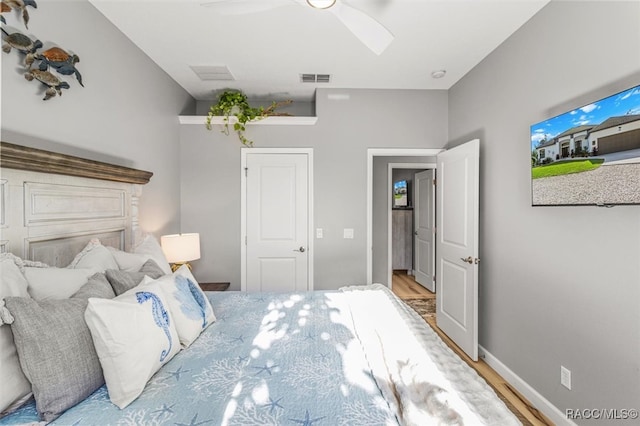 bedroom featuring ceiling fan and wood-type flooring