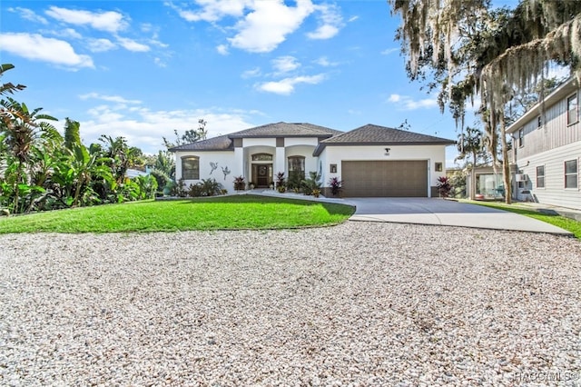 view of front facade featuring a front lawn and a garage