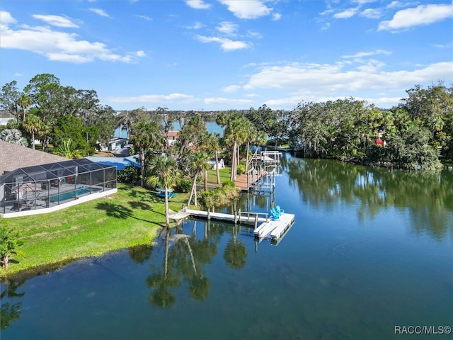 dock area featuring glass enclosure, a yard, and a water view