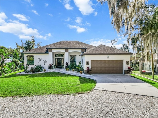 view of front of home with a garage and a front yard