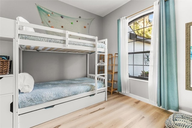 bedroom with light hardwood / wood-style floors