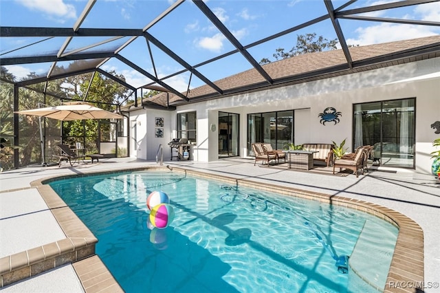 view of pool with outdoor lounge area, area for grilling, a lanai, and a patio