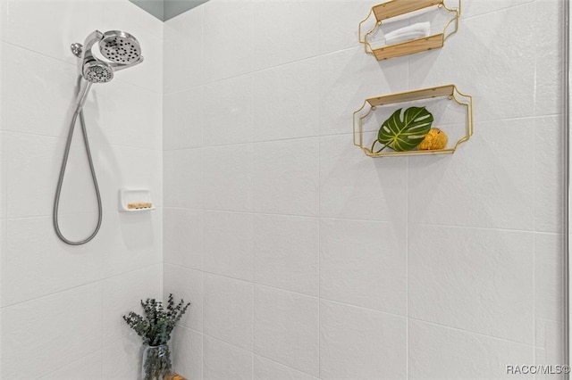 bathroom with tiled shower