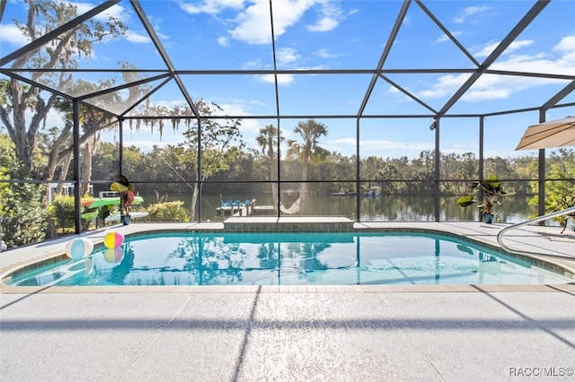 view of swimming pool with a lanai, a water view, and a patio