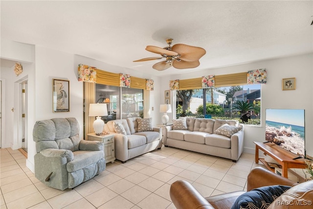 living room with ceiling fan and light tile patterned floors