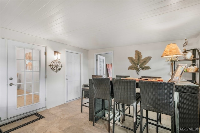 dining space with wood ceiling