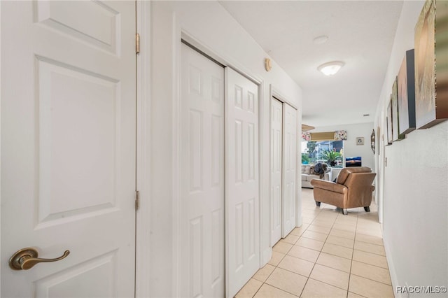 hallway with light tile patterned flooring