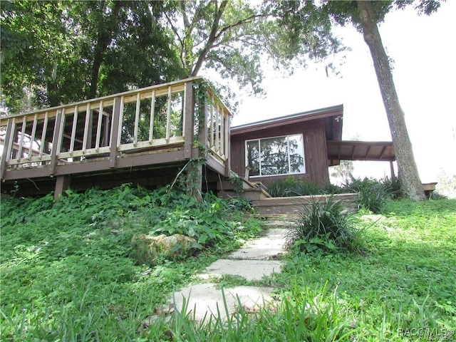 view of side of home featuring a deck