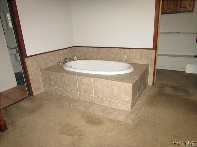 bathroom featuring a bath and tile patterned floors