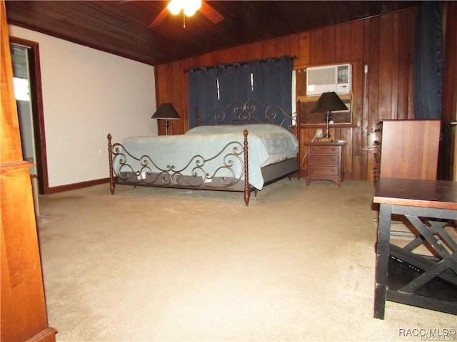 bedroom featuring carpet, a wall unit AC, lofted ceiling, wooden walls, and wooden ceiling