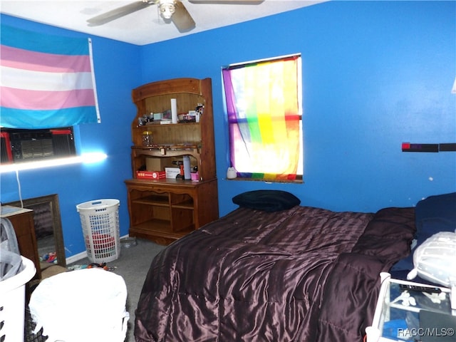 bedroom with carpet, ceiling fan, and cooling unit