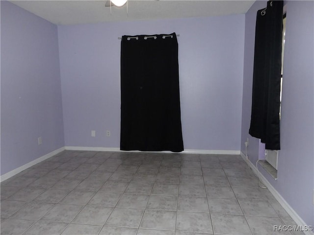 spare room with light tile patterned floors