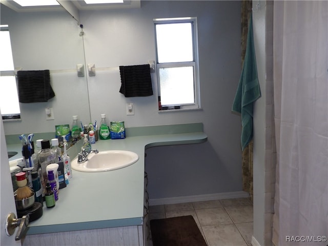 bathroom with tile patterned flooring and vanity