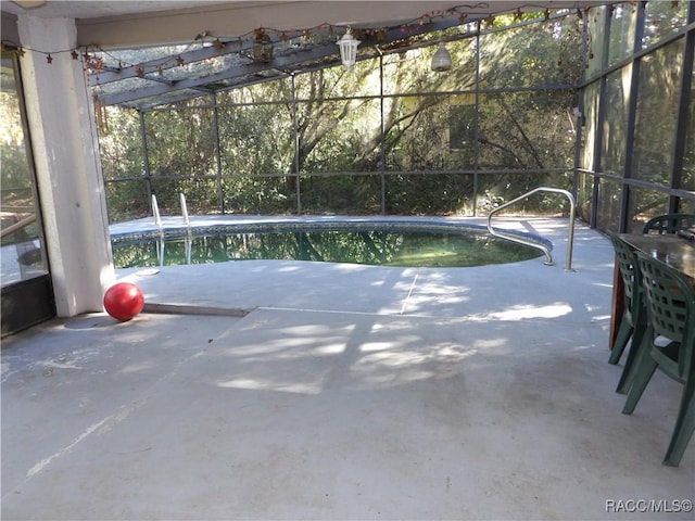 view of pool featuring a lanai and a patio