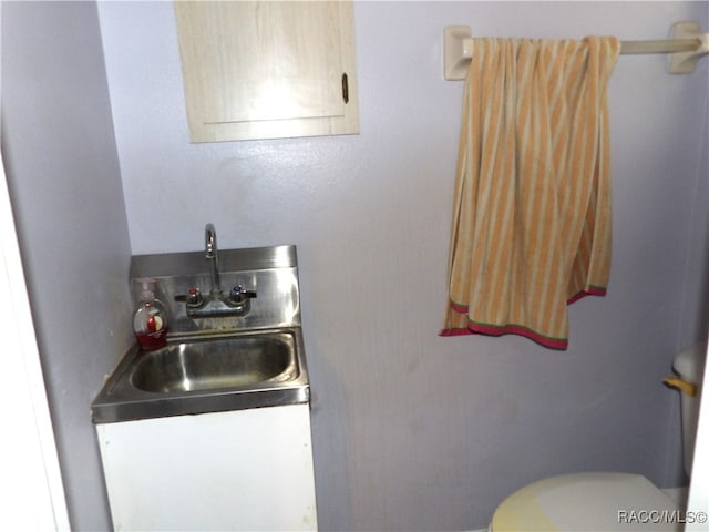 interior space with vanity and toilet