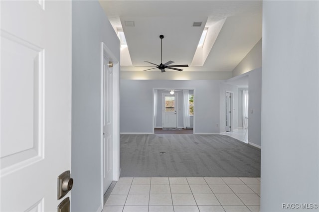 interior space featuring light colored carpet and vaulted ceiling