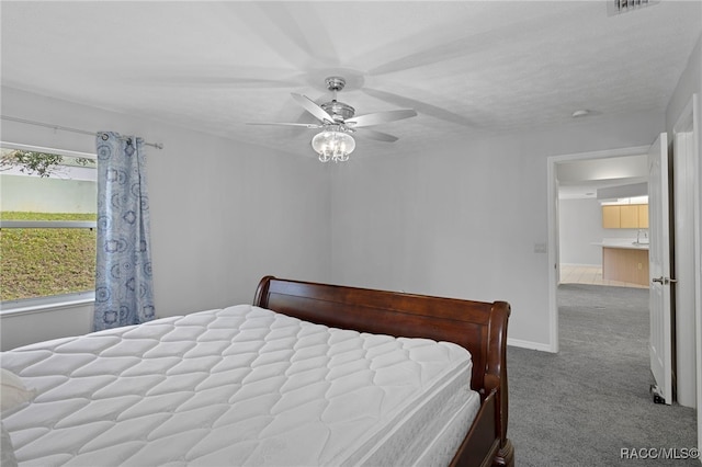 bedroom featuring carpet and ceiling fan