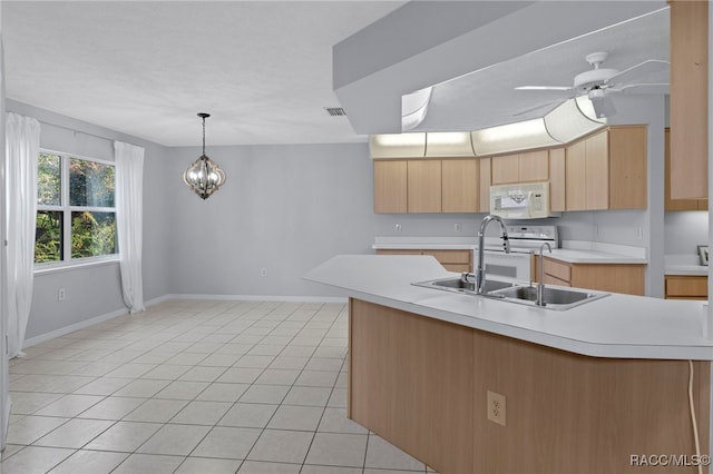 kitchen featuring sink, light brown cabinets, decorative light fixtures, light tile patterned flooring, and ceiling fan with notable chandelier