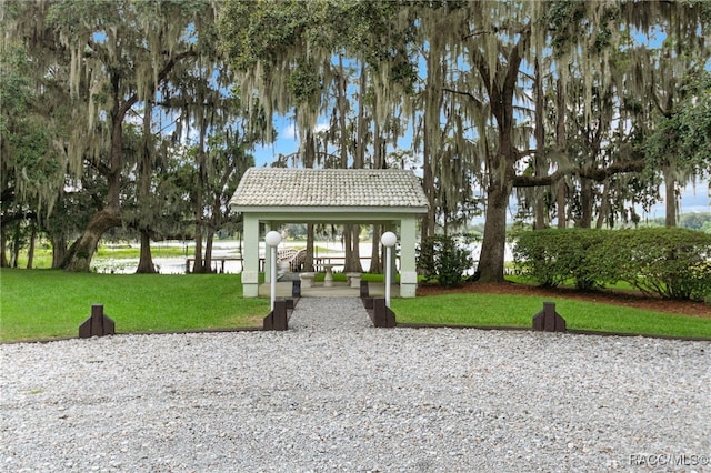 view of home's community with a gazebo and a yard