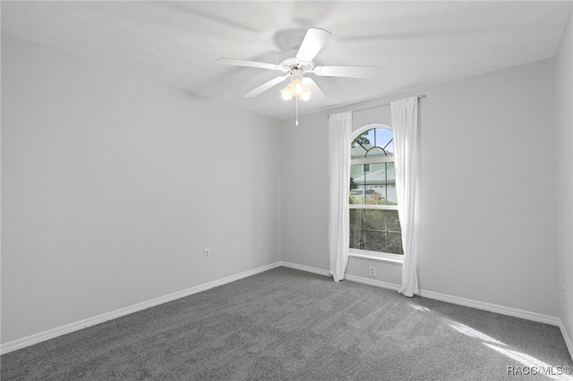 empty room with carpet and ceiling fan