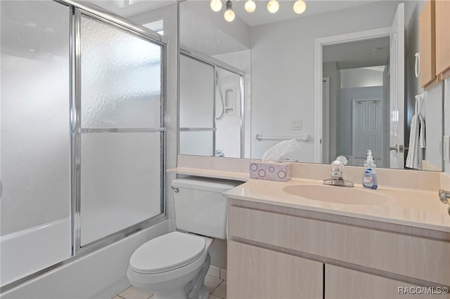 full bathroom with tile patterned flooring, vanity, toilet, and enclosed tub / shower combo