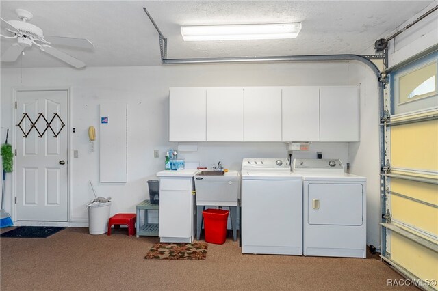 garage with washing machine and dryer and ceiling fan