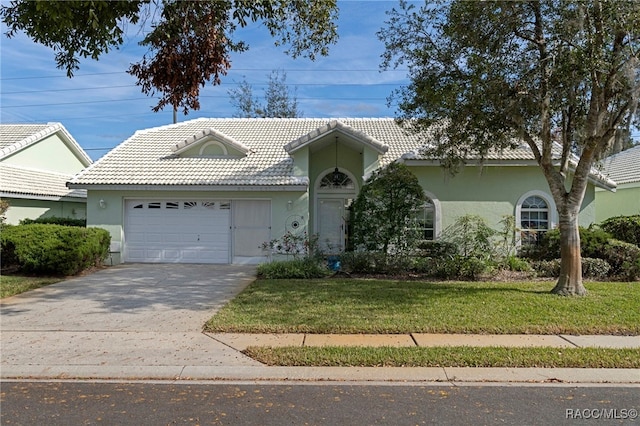 view of front facade featuring a garage and a front lawn