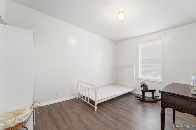7187 Montier St, Weeki Wachee, FL 34613 - bedroom with wood finished floors and baseboards