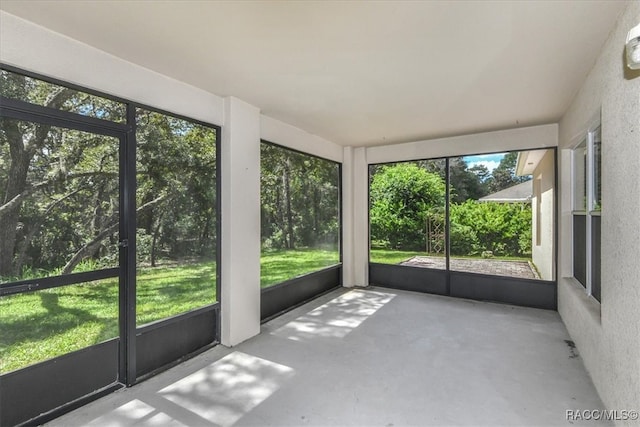 unfurnished sunroom featuring a wealth of natural light