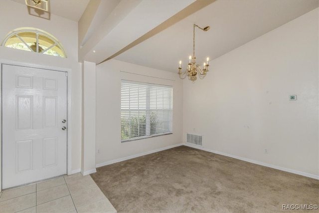 entryway featuring a notable chandelier, light colored carpet, and lofted ceiling