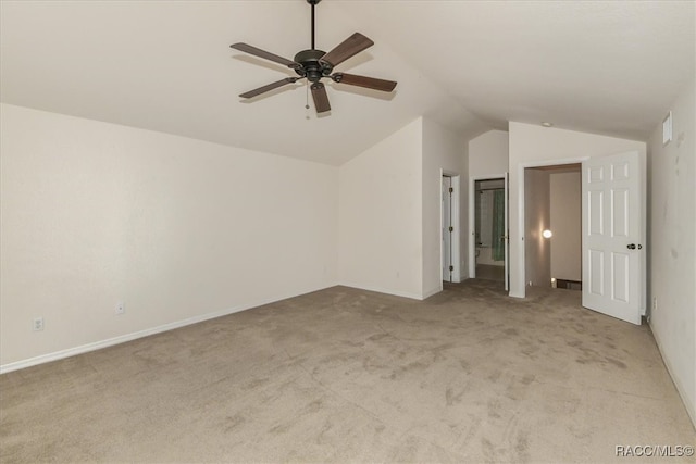 additional living space with ceiling fan, light colored carpet, and lofted ceiling