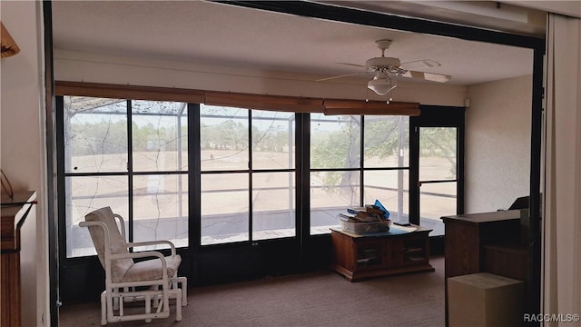 sunroom with ceiling fan and plenty of natural light