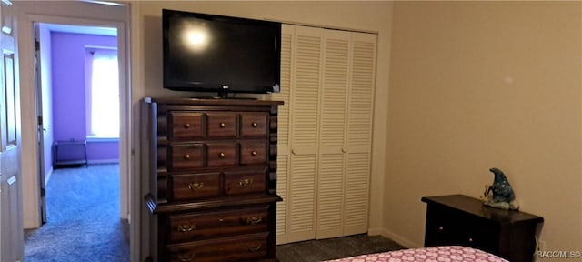 carpeted bedroom with a closet