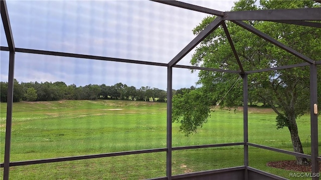 735 W Colbert Ct, Beverly Hills, FL 34465 - unfurnished sunroom featuring view of scattered trees