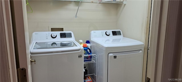 washroom featuring washer and dryer