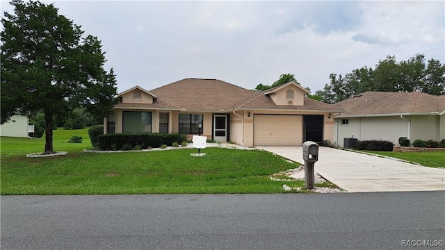 735 W Colbert Ct, Beverly Hills, FL 34465 - ranch-style home with driveway, a garage, a front yard, and stucco siding