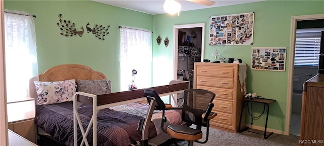 bedroom featuring ceiling fan, light colored carpet, and a closet