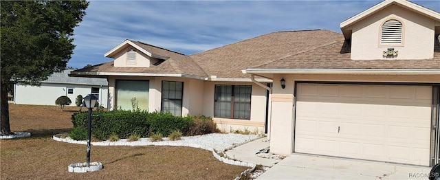 view of front of home featuring a front lawn and a garage