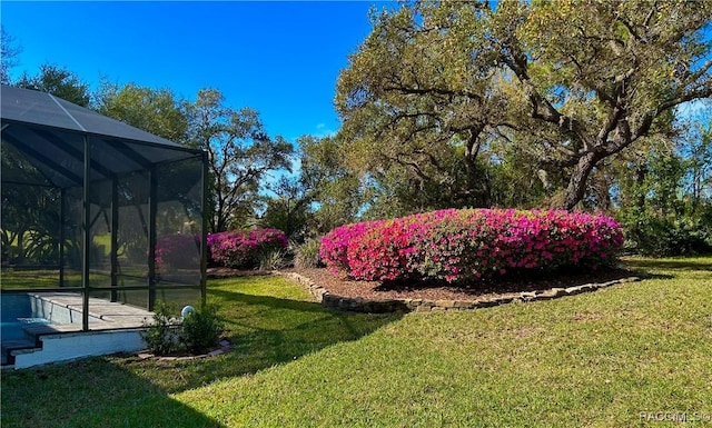 view of yard featuring a lanai