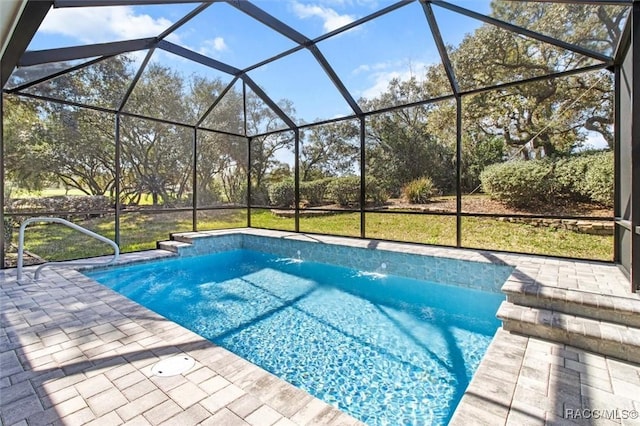 outdoor pool featuring a patio and a lanai