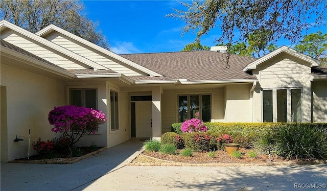 entrance to property with stucco siding