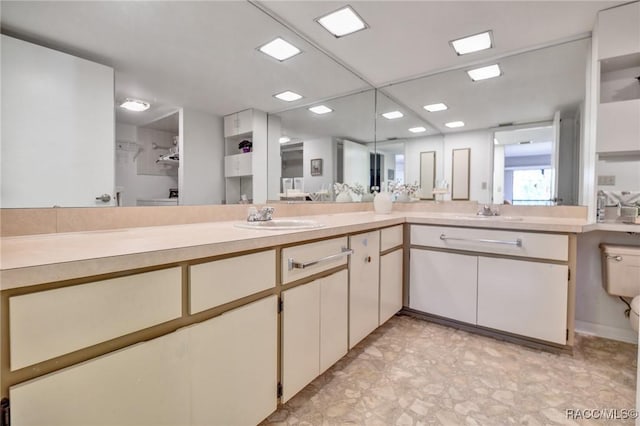 bathroom with double vanity and a sink