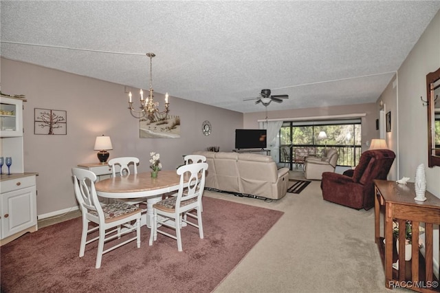 dining room with carpet, a textured ceiling, and ceiling fan with notable chandelier