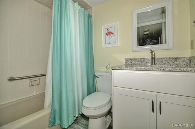 full bath featuring vanity, toilet, and shower / bath combo with shower curtain