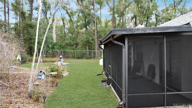 view of yard with a sunroom