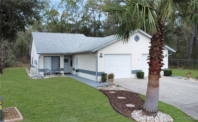 view of front facade featuring a garage and a front yard