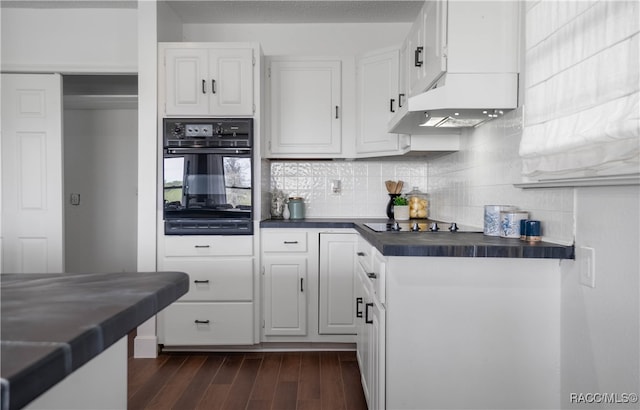 kitchen featuring backsplash, dark wood-type flooring, black appliances, white cabinets, and custom range hood