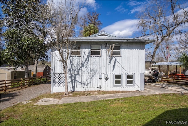 rear view of house with a lawn