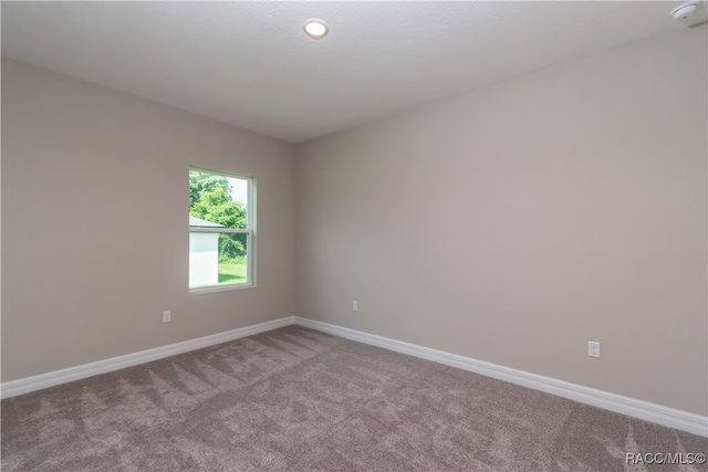 empty room with light colored carpet