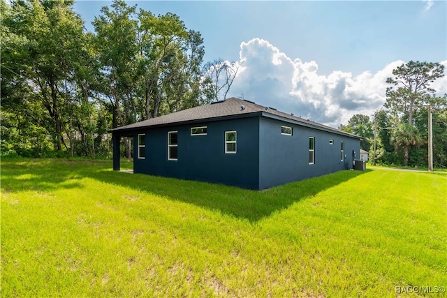 view of property exterior with a yard